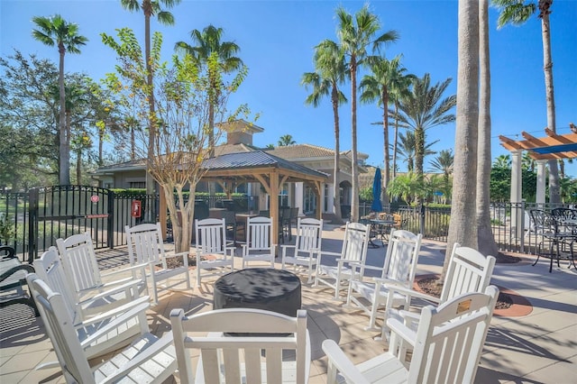 view of patio with a gazebo and an outdoor fire pit