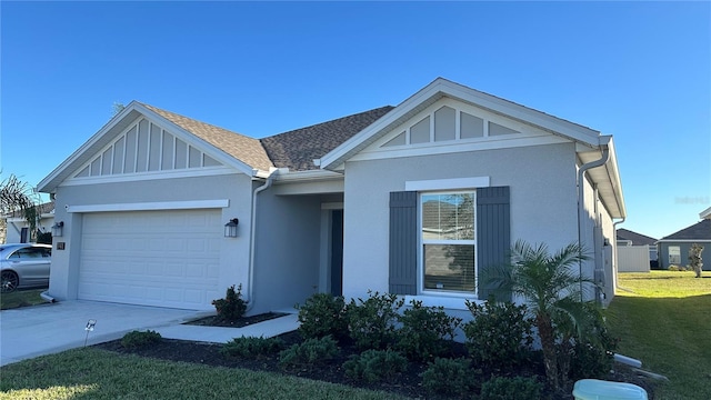 view of front facade with a front yard and a garage