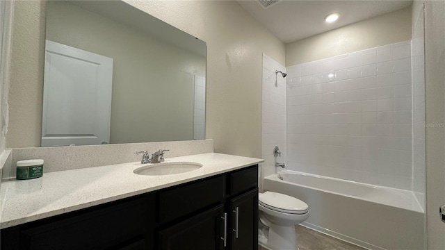 full bathroom with vanity,  shower combination, and toilet