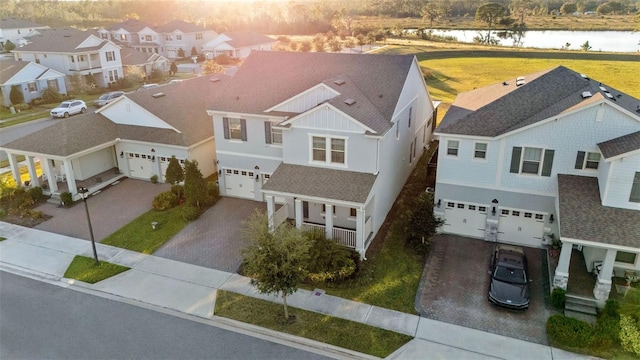 birds eye view of property with a water view