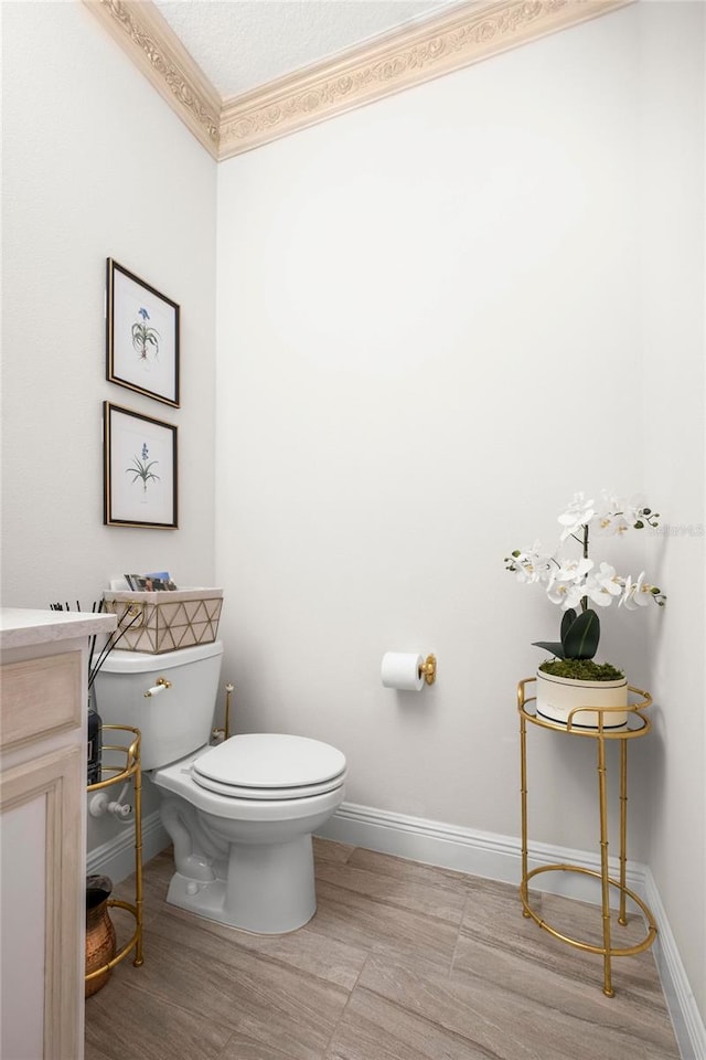 bathroom featuring toilet and vanity