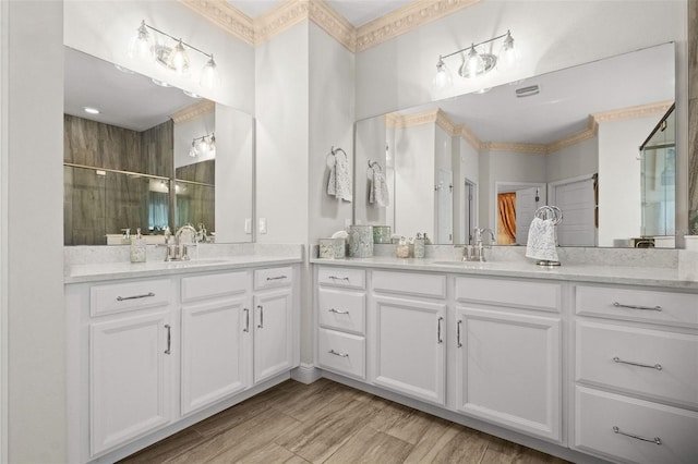 bathroom with an enclosed shower and vanity