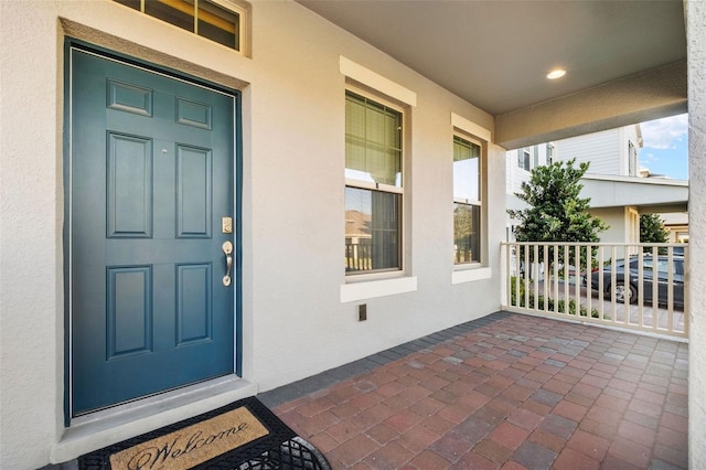 doorway to property featuring a porch