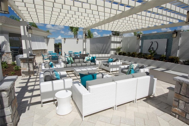 view of patio / terrace featuring an outdoor hangout area and a pergola