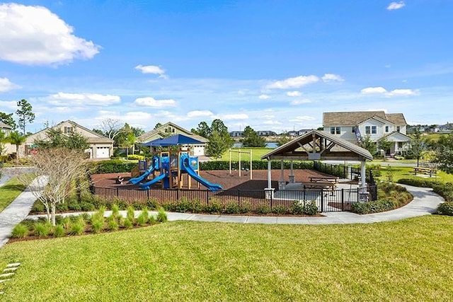 view of playground with a lawn and a gazebo