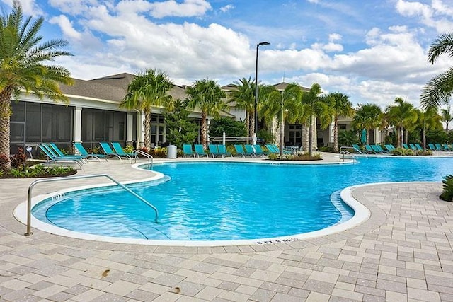 view of swimming pool with a patio area