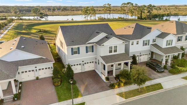 birds eye view of property featuring a water view