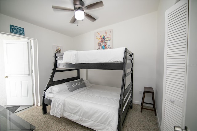 bedroom featuring ceiling fan and carpet