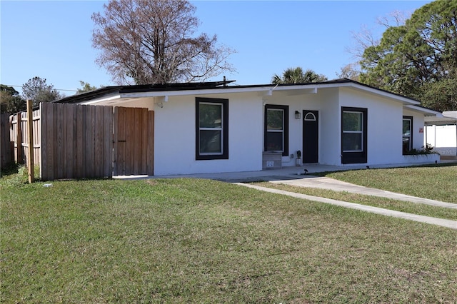 ranch-style house with a front yard