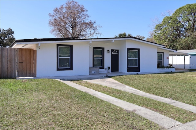 ranch-style house featuring a front yard