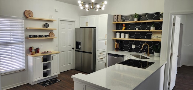 kitchen with sink, white cabinets, and stainless steel appliances