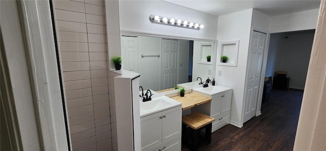 bathroom with vanity and hardwood / wood-style flooring