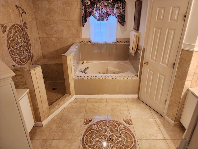 bathroom featuring tile patterned flooring, vanity, and independent shower and bath