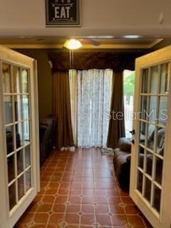 sitting room with tile patterned flooring and french doors