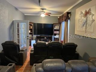 living room with a ceiling fan