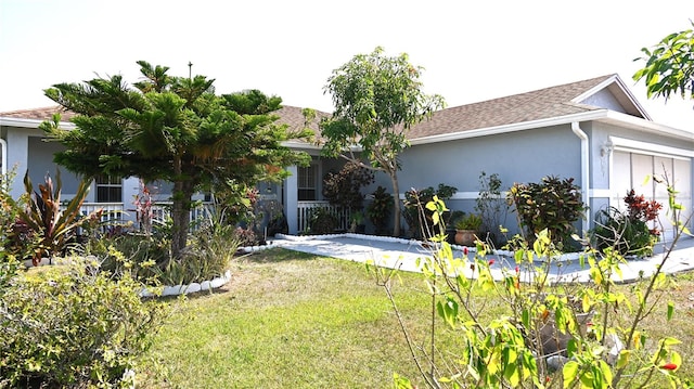 back of property featuring a garage