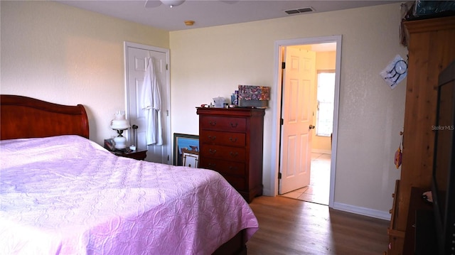 bedroom with hardwood / wood-style flooring and ceiling fan