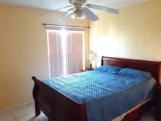 bedroom with ceiling fan and light tile patterned floors