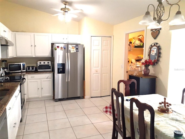 kitchen featuring pendant lighting, white cabinets, ceiling fan, light tile patterned floors, and stainless steel appliances