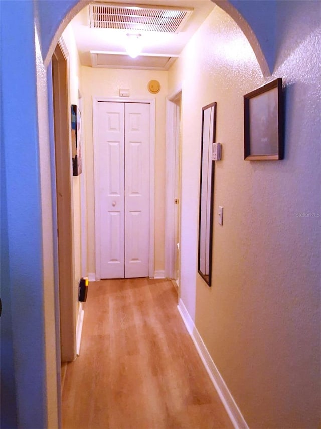 hall with light wood-type flooring