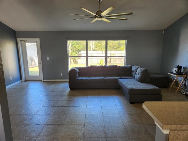 living room with plenty of natural light and ceiling fan