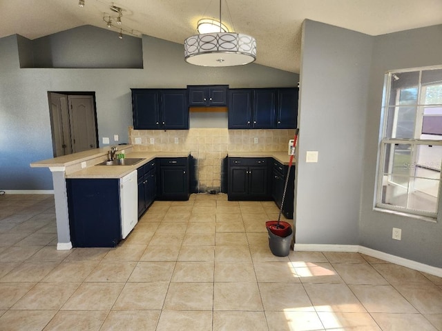 kitchen with sink, kitchen peninsula, pendant lighting, vaulted ceiling, and light tile patterned floors