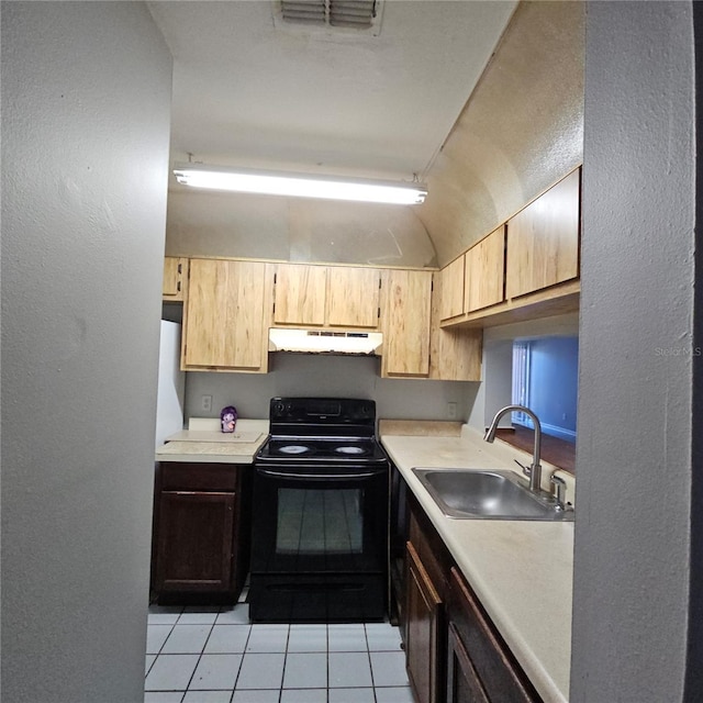 kitchen with light tile patterned floors, black range with electric stovetop, and sink