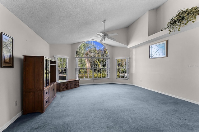 unfurnished living room featuring carpet, ceiling fan, a textured ceiling, and high vaulted ceiling