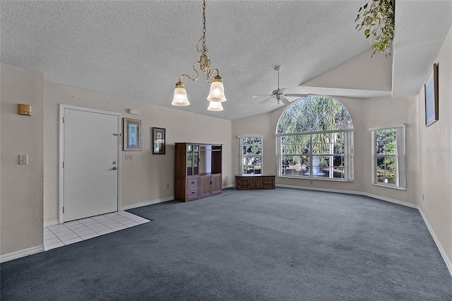 unfurnished living room featuring a textured ceiling, ceiling fan with notable chandelier, light colored carpet, and lofted ceiling