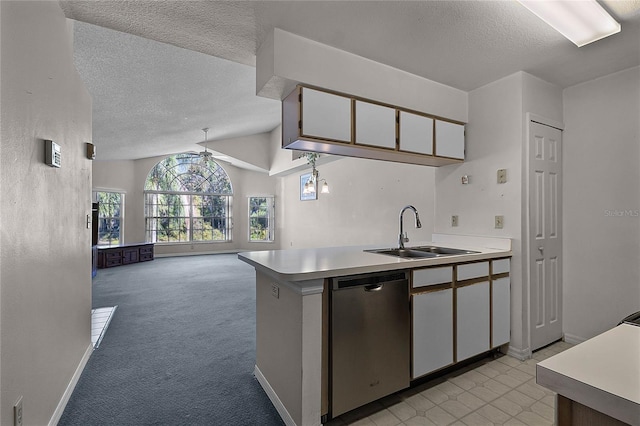 kitchen with light carpet, sink, dishwasher, white cabinetry, and lofted ceiling