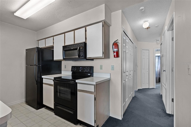 kitchen with light colored carpet, white cabinets, black appliances, and a textured ceiling