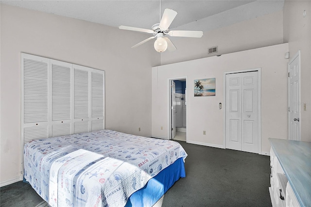 bedroom with ceiling fan and dark carpet