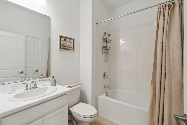 full bathroom with vanity, toilet, and shower / bath combo with shower curtain