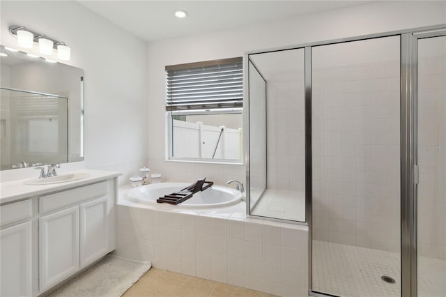 bathroom with separate shower and tub, tile patterned flooring, and vanity