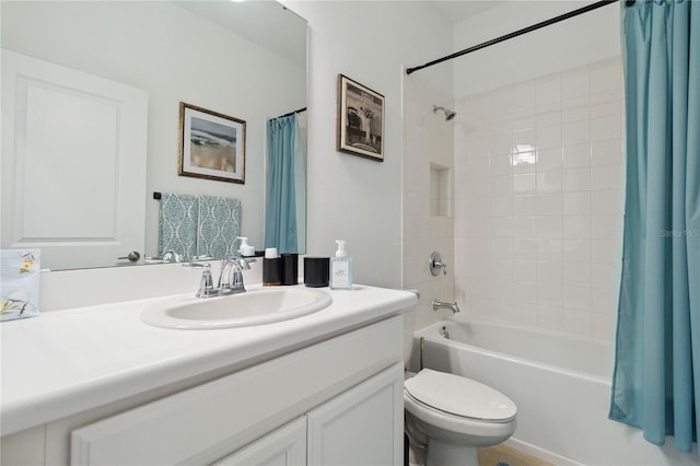 full bathroom featuring shower / bath combination with curtain, toilet, and vanity