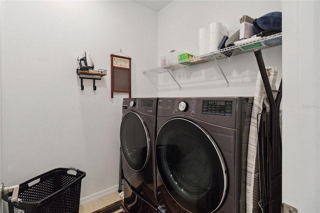 laundry area featuring washing machine and clothes dryer