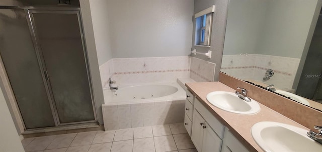 bathroom with tile patterned flooring, vanity, and plus walk in shower