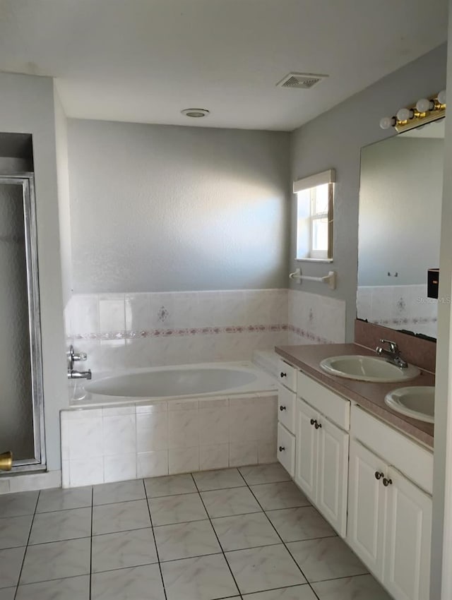 bathroom featuring vanity and plus walk in shower