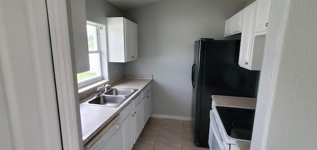 kitchen featuring white cabinetry, sink, light tile patterned floors, and white appliances