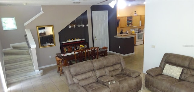 tiled living room with ceiling fan