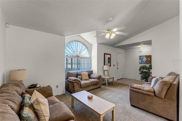 living room with a textured ceiling, ceiling fan, light colored carpet, and lofted ceiling