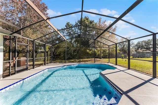 view of swimming pool with a patio area, a lanai, and a yard