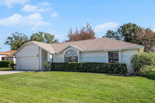 ranch-style home with a front lawn and a garage