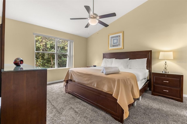 bedroom featuring ceiling fan, light colored carpet, and vaulted ceiling