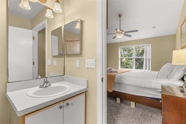 bathroom with ceiling fan and vanity