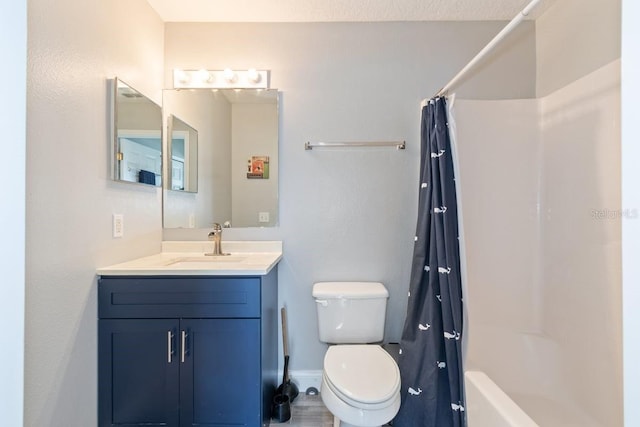 full bathroom featuring vanity, toilet, and shower / tub combo