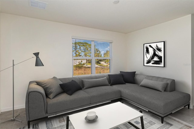 living room with light tile patterned floors