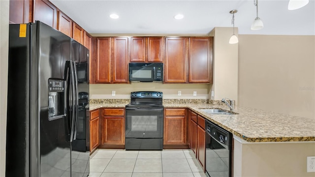 1336 Chelsea Dr, Davenport, FL 33897 - kitchen featuring black appliances, a peninsula, light tile patterned flooring, decorative light fixtures, and light stone countertops
