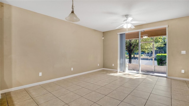 spare room with light tile patterned floors and ceiling fan