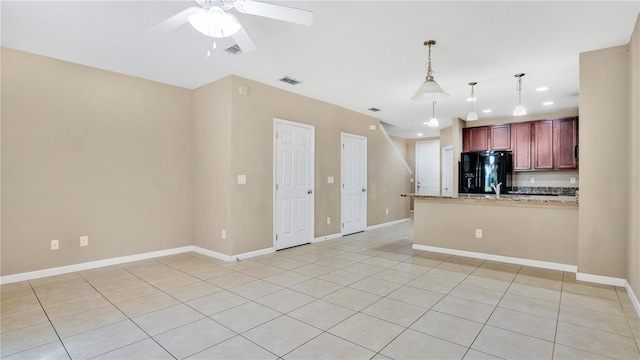 1336 Chelsea Dr, Davenport, FL 33897 - kitchen featuring black refrigerator with ice dispenser, ceiling fan, a peninsula, light tile patterned floors, and pendant lighting